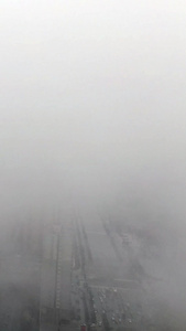 航拍云雾高楼城市航拍视频