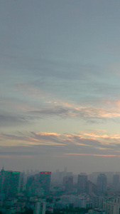 航拍青岛夕阳中的城市和天空视频