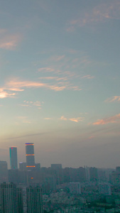 航拍青岛夕阳中的城市和天空视频
