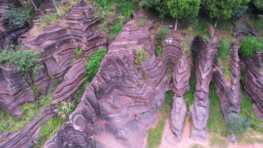 航拍湖南旅游4A级景区湘西红石林国家地质公园红色岩石4k素材视频