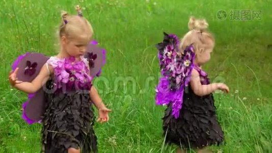 穿着蝴蝶服装的女孩走在草坪上视频
