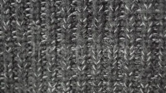 针织面料冬季灰色毛衣.. 详细的特写在UHD分辨率。视频