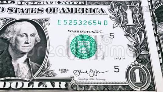 一张一美元钞票的滑动视频，显示了美国总统乔治·华盛顿的肖像。视频