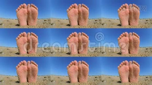 双腿散落在沙滩上的沙子上。视频