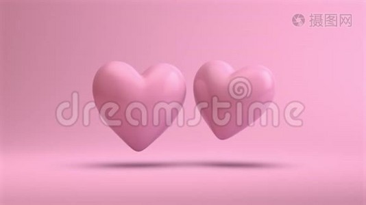粉红色的心在干净的粉红色背景上漂浮在空气中视频