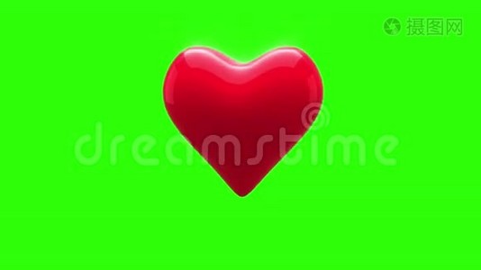 红色的心在绿色的背景上跳动视频