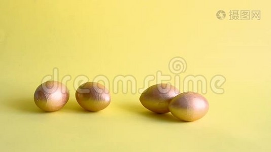 复活节黄金装饰彩蛋黄色背景视频