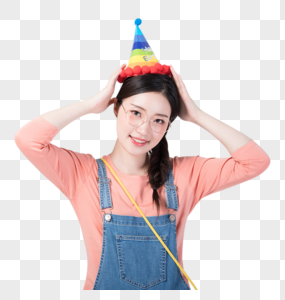 戴着生日帽微笑庆祝的青年女性图片图片