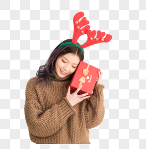 手拿礼盒带着鹿角的圣诞女性人像图片