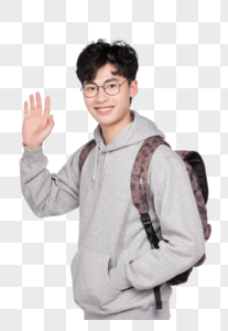 背着书包招招手打招呼的同学图片素材