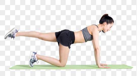 在瑜伽垫上运动健身练习的年轻女性高清图片