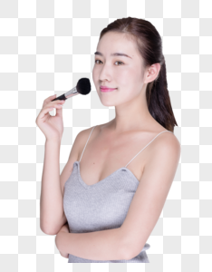 美女用笔刷化妆图片