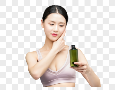 性感美女手持精华乳液瓶装图片