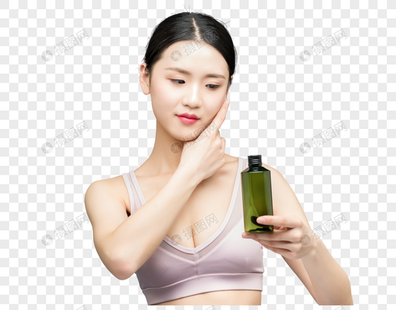 性感美女手持精华乳液瓶装图片