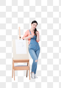 青年美女手拿铅笔站在画架旁高清图片