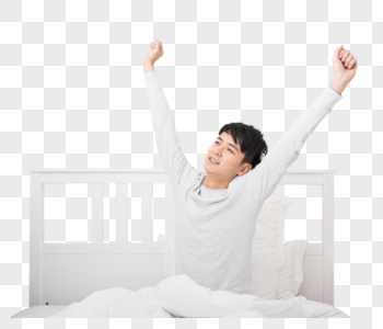 准备起床伸懒腰的年轻男子图片素材