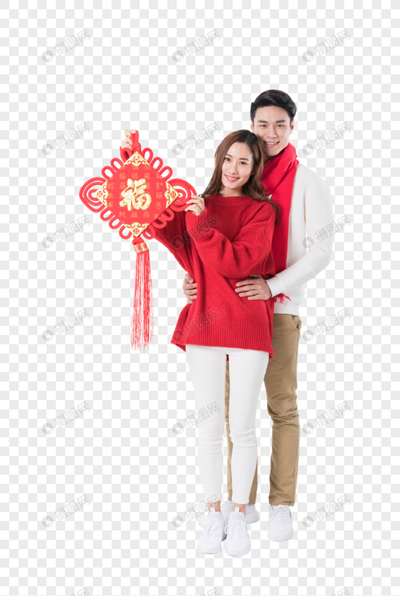 年轻夫妻拿着新年中国结图片