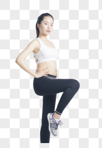 抬腿运动的健身女性图片
