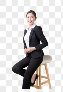 坐凳子上的商务女性图片