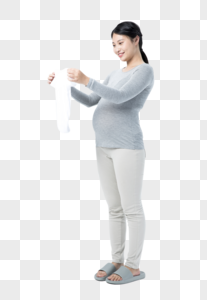 孕妇拿着婴儿衣物图片