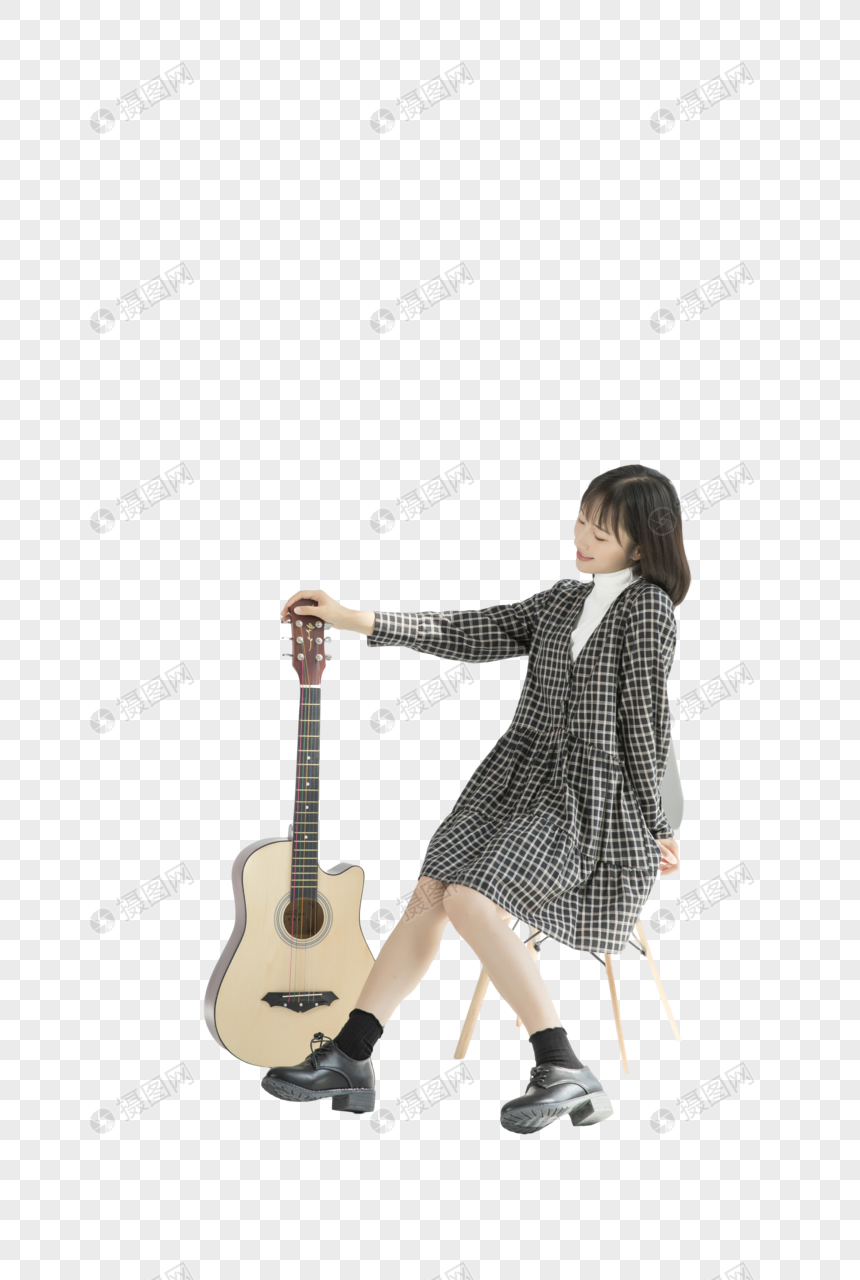 少女手拿尤克里里坐在凳子上