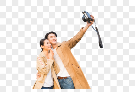 年轻情侣拿相机拍照高清图片