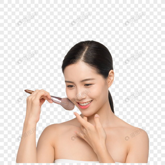 美女用化妆刷涂腮红图片