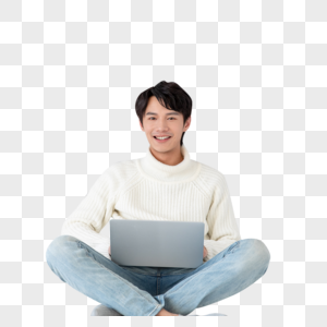 青年男性坐着使用电脑图片