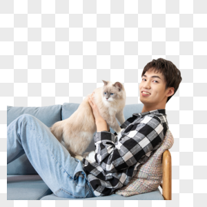 坐在沙发上抱着猫的男孩图片