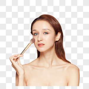 女性拿粉笔刷化妆图片