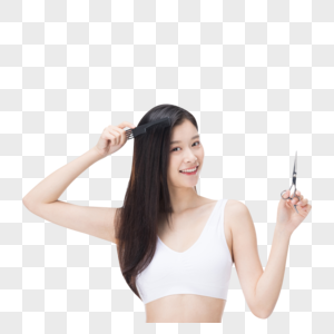 年轻女性使用梳子梳头发图片