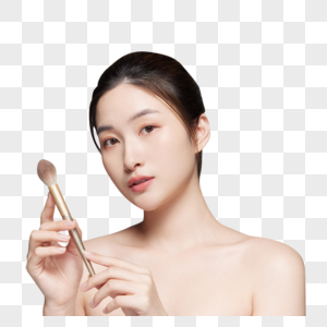 女性拿粉笔刷化妆高清图片