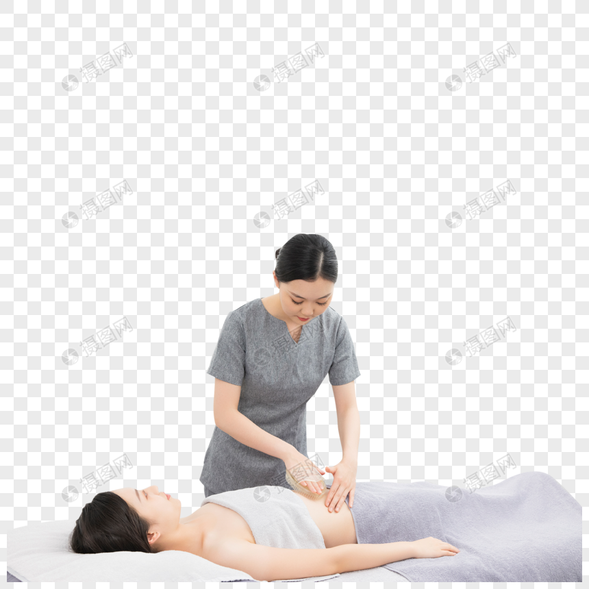 按摩师给美女顾客按摩腹部