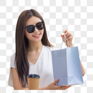 戴墨镜的美女购物消费手拎购物袋图片