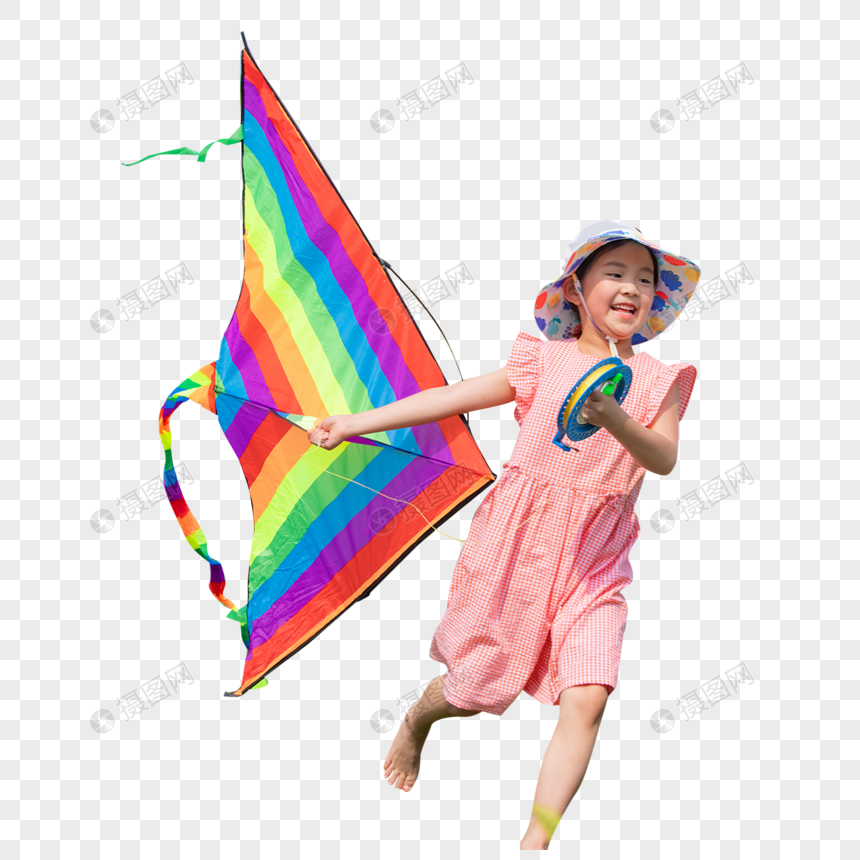小女孩拿着风筝在草地上奔跑图片