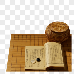 围棋棋盘上的棋子和书高清图片