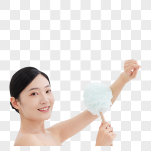 女性躺在浴缸手拿浴球刷洗澡高清图片