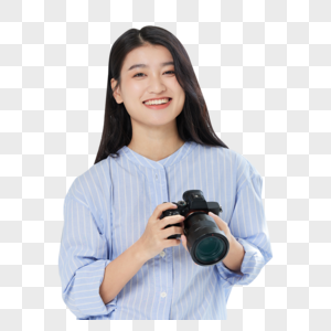 青年女摄影师手拿相机图片
