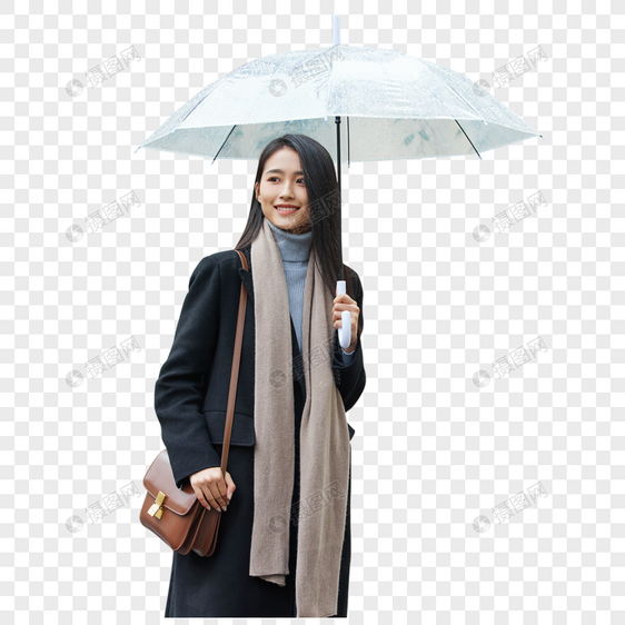 下雨天在城市里行走的女性图片