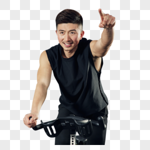 使用动感单车训练的健身男士图片