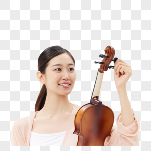 给小提琴调音的青年女性图片