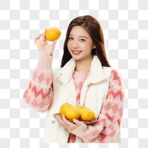 手捧橘子的冬日女性图片