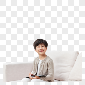 沙发上使用平板电脑的男孩形象图片
