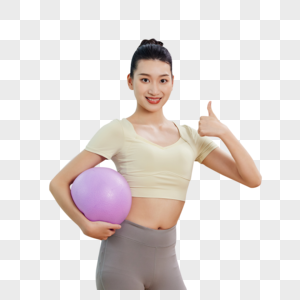 运动女生抱着瑜伽球点赞图片