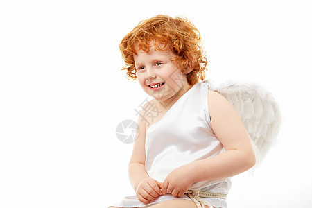 开朗的小男孩,以丘比特的形象,孤立白色的背景上图片