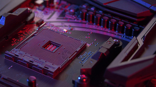 主板与处理器镜头电路板上的计算机部件亮着红色蓝色的盖子主板与处理器镜头图片