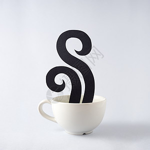 创意静止生活照片的浓缩咖啡杯杯饮料与香气,味道蒸汽烟雾由纸灰色背景图片