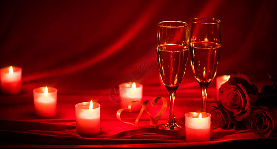 葡萄酒杯情人节背景与香槟杯,玫瑰,蜡烛心香槟杯蜡烛背景