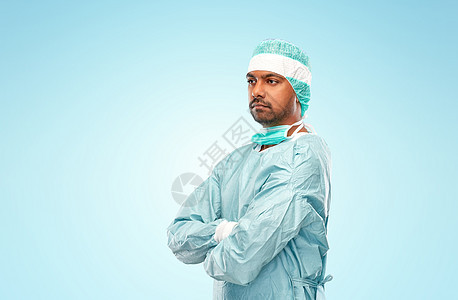 医学,外科人的印度男医生或外科医生蓝色背景下穿防护服穿着防护服的印度男医生或外科医生图片