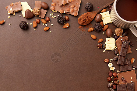 糖果,糖果食品热巧克力与坚果,糖果可可粉棕色背景热巧克力加坚果,可可粉糖果图片